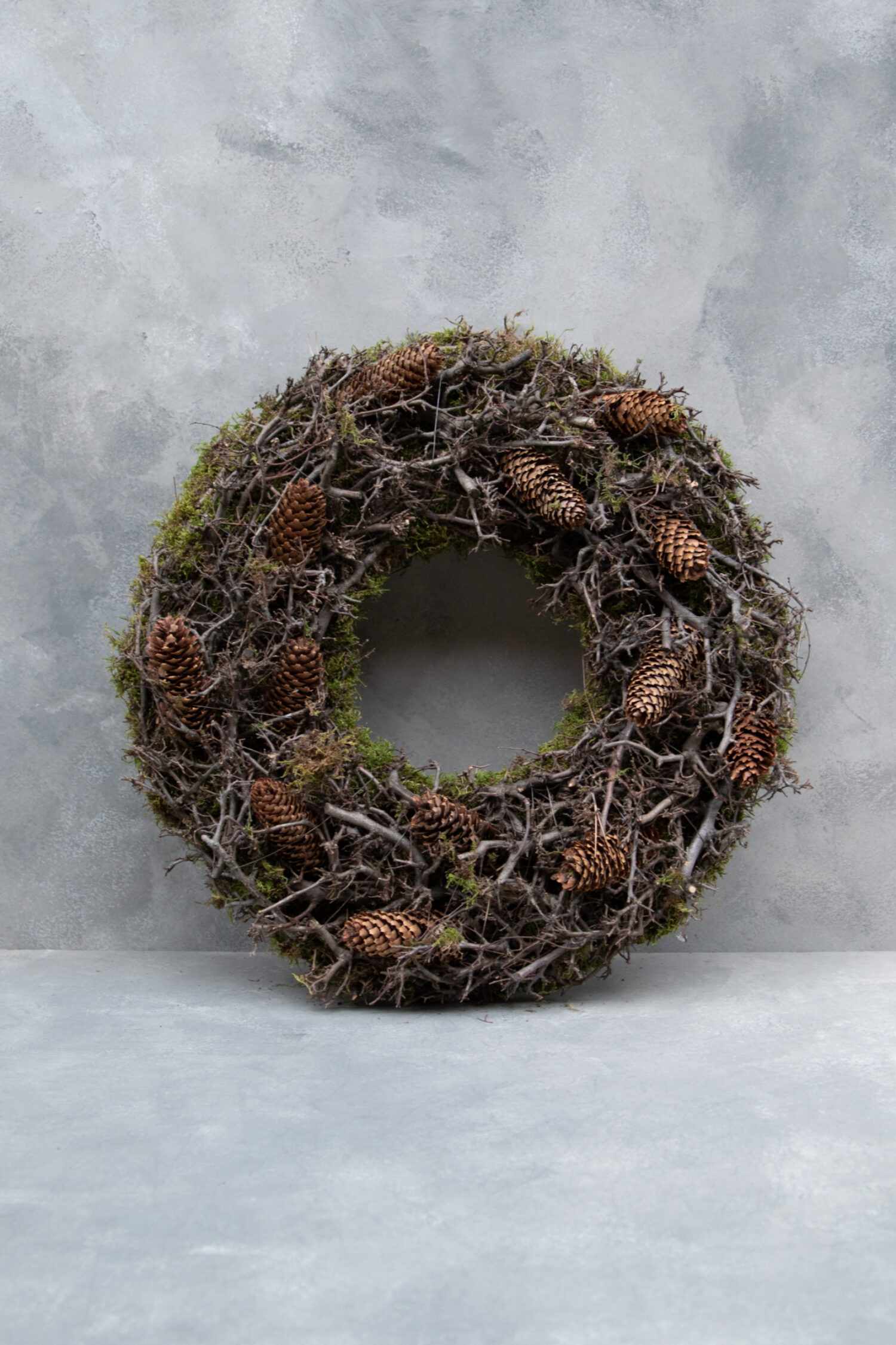 Bonsai moss wreath with cone